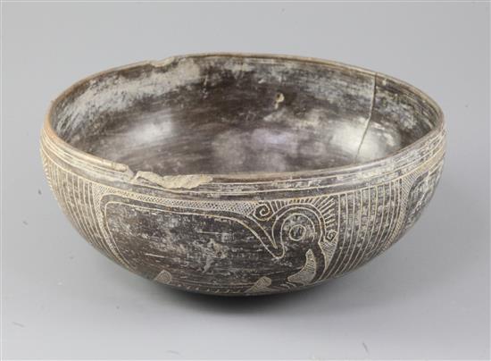 A pre-Columbian black ware bowl, Peru, diameter 20cm, cracks